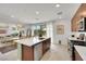 Bright, modern kitchen with stainless steel appliances, island with breakfast bar, and open floor plan at 513 Monarch Ridge Ct, North Las Vegas, NV 89084