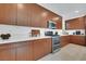 Modern kitchen with sleek cabinets, stainless steel appliances, and ample counter space at 513 Monarch Ridge Ct, North Las Vegas, NV 89084