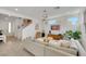 Airy living room with modern furniture, bright natural light and a staircase leading upstairs at 513 Monarch Ridge Ct, North Las Vegas, NV 89084