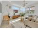 Bright living room features neutral tones, modern decor, and ample natural light from multiple windows at 513 Monarch Ridge Ct, North Las Vegas, NV 89084
