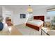 Beautifully furnished main bedroom with hardwood floors and a cozy atmosphere at 513 Monarch Ridge Ct, North Las Vegas, NV 89084
