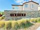 Community entrance sign with stone and drought-resistant plants at 513 Monarch Ridge Ct, North Las Vegas, NV 89084