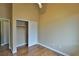 Bedroom featuring wood floors, a closet with sliding doors, and neutral-colored walls at 5236 Ladyhawk Way, Las Vegas, NV 89118