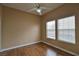 Cozy bedroom with ceiling fan, hardwood floors, and lots of natural light at 5236 Ladyhawk Way, Las Vegas, NV 89118