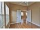 Bedroom showing hardwood floors, neutral color palette, and large windows at 5236 Ladyhawk Way, Las Vegas, NV 89118