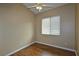 Bedroom with wood flooring, a ceiling fan, and a window providing natural light at 5236 Ladyhawk Way, Las Vegas, NV 89118