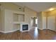 Bright living room with fireplace, built in shelving and hardwood flooring at 5236 Ladyhawk Way, Las Vegas, NV 89118