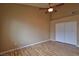 Main bedroom with wood floors, a ceiling fan, and a closet with sliding doors at 5236 Ladyhawk Way, Las Vegas, NV 89118