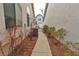 The side yard walkway offers a neatly landscaped path and easy access to the property at 5236 Ladyhawk Way, Las Vegas, NV 89118