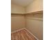 A spacious walk-in closet with custom shelving for optimal storage and organization at 5236 Ladyhawk Way, Las Vegas, NV 89118