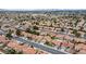 Expansive aerial view of a desert neighborhood featuring well-maintained homes and neat landscaping at 5609 Red Bluff Dr, Las Vegas, NV 89130