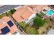 Birds eye view of a backyard with a patio featuring a white pergola, lots of greenery and mature landscaping at 5609 Red Bluff Dr, Las Vegas, NV 89130