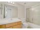 Standard bathroom showcasing a shower-tub combination with a glass door and a large mirror at 5609 Red Bluff Dr, Las Vegas, NV 89130