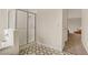 Bathroom including the shower, sink, and a view into a nearby room with a glider at 5609 Red Bluff Dr, Las Vegas, NV 89130