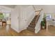 Inviting entryway with hardwood floors, leading to the staircase and other living areas at 5609 Red Bluff Dr, Las Vegas, NV 89130