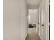 Hallway featuring neutral walls and carpet, with views into other rooms at 5609 Red Bluff Dr, Las Vegas, NV 89130