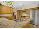Kitchen area featuring wood cabinets, stainless steel appliances and granite countertops at 5609 Red Bluff Dr, Las Vegas, NV 89130