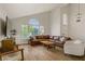 Inviting living room with vaulted ceilings, ample natural light, and comfortable seating at 5609 Red Bluff Dr, Las Vegas, NV 89130
