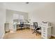 Spacious office includes two white desks, rolling chairs, and ample natural light from a window at 5609 Red Bluff Dr, Las Vegas, NV 89130