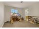 Bright playroom featuring a toy kitchen, window, and views into the nearby bathroom at 5609 Red Bluff Dr, Las Vegas, NV 89130