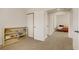 Bright playroom with toy storage shelving with views into a bedroom with a bed and dresser at 5609 Red Bluff Dr, Las Vegas, NV 89130
