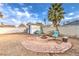 Large backyard featuring seating around a fire pit, mature trees, and a small shed at 5809 Robin Ln, Las Vegas, NV 89108