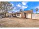 Expansive backyard with covered patio, mature trees, and ample space for outdoor living and entertaining at 5809 Robin Ln, Las Vegas, NV 89108