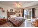 Bedroom featuring a sliding glass door, a wooden bed frame, laminate floors and natural light at 5809 Robin Ln, Las Vegas, NV 89108