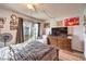 Bedroom featuring a sliding glass door, a wooden bed frame, laminate floors and natural light at 5809 Robin Ln, Las Vegas, NV 89108
