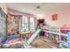 bedroom features laminate floors, a bunk bed with slide, and a window for natural lighting at 5809 Robin Ln, Las Vegas, NV 89108