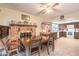Cozy dining room featuring a brick fireplace and access to the kitchen at 5809 Robin Ln, Las Vegas, NV 89108