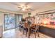 Cozy dining room featuring a brick fireplace and access to the outdoor patio at 5809 Robin Ln, Las Vegas, NV 89108
