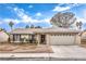 Charming single-story home featuring a two-car garage and a welcoming front porch at 5809 Robin Ln, Las Vegas, NV 89108