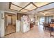 Kitchen flows into the dining area, featuring tile flooring, a refrigerator, and plenty of space at 5809 Robin Ln, Las Vegas, NV 89108