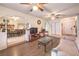 Inviting living room with hardwood floors, ceiling fans, and ample natural light at 5809 Robin Ln, Las Vegas, NV 89108