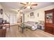 Inviting living room with hardwood floors, ceiling fans, and ample natural light at 5809 Robin Ln, Las Vegas, NV 89108