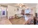 Inviting living room with hardwood floors, ceiling fans, and ample natural light at 5809 Robin Ln, Las Vegas, NV 89108