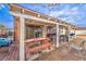 Covered patio includes a picnic table, seating, and sliding glass door access to the home at 5809 Robin Ln, Las Vegas, NV 89108