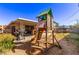 Spacious backyard features a playset, patio, grill, and room to entertain at 5813 Halifax Ave, Las Vegas, NV 89107
