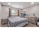 Bedroom featuring a full sized bed with a large window for natural light at 5813 Halifax Ave, Las Vegas, NV 89107