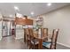 Dining room with a view to a stainless steel refrigerator and the kitchen at 5813 Halifax Ave, Las Vegas, NV 89107