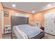 Spacious main bedroom featuring a large bed, closet and plenty of natural light at 5813 Halifax Ave, Las Vegas, NV 89107