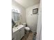 Functional bathroom with white vanity and tiled floor at 6212 Burgundy Way, Las Vegas, NV 89107