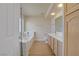 Bright bathroom with wood-look floors, double sinks and a separate tub at 6332 Sierra Pines Ct, Las Vegas, NV 89130