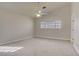 Spacious carpeted bedroom with ceiling fan and window, perfect for rest and relaxation at 6332 Sierra Pines Ct, Las Vegas, NV 89130