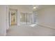 Bright bedroom featuring carpet floors, ceiling fan, and mirrored closet at 6332 Sierra Pines Ct, Las Vegas, NV 89130