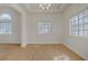Bright dining room with windows providing natural light and wood-look floors at 6332 Sierra Pines Ct, Las Vegas, NV 89130