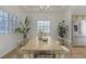 Staged dining room showcasing modern chandelier, dining table, and plenty of natural light at 6332 Sierra Pines Ct, Las Vegas, NV 89130