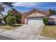 Charming single-story home featuring a two-car garage and well-maintained landscaping at 6332 Sierra Pines Ct, Las Vegas, NV 89130