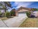 Charming single-story home with a two-car garage and a well-kept lawn at 6332 Sierra Pines Ct, Las Vegas, NV 89130